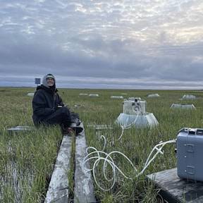 Lauren recording flux data in Atqasuk at night